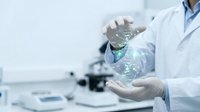 Scientist in white lab coat holding glowing DNA double helix hologram in modern laboratory with microscope background for medical research and biotechnology.
