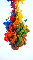 Vibrant multicolored paint explosion in water creating abstract fluid motion with rainbow hues for creative design projects and artistic backgrounds.