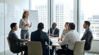 Professional businesswoman presenting strategy to diverse corporate team in modern conference room with city skyline view during executive meeting.