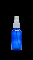 Blue glass spray bottle with white mist atomizer isolated on transparent background, ready for cosmetics, skincare, perfume, and cleaning product packaging design use.