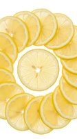 Fresh lemon slices arranged in a circle on white background, isolated. Bright yellow citrus fruit pattern for food, health, and summer designs.