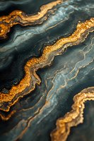 Luxurious dark teal and gold marble texture with flowing wavy lines and glitter effect creates elegant abstract pattern for luxury design backgrounds.