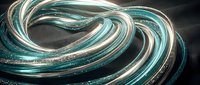 Glowing teal and silver spiral tubes with glitter shimmer on dark fabric, creating a futuristic, elegant abstract composition.