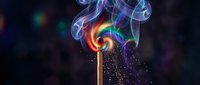 Colorful rainbow smoke swirls rising from wooden matchstick creating magical ethereal effect against dark background for creative design projects.