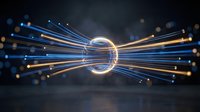 Glowing fiber optic cables converging through luminous ring creating dynamic light trails with bokeh effects on dark background for technology concepts.