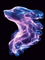 Glowing abstract smoke shape in blue and pink neon colors against black background creates mysterious ethereal effect for creative design projects.