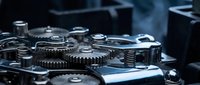 Close-up of precision metal gears and mechanical components in industrial machinery. Detailed view of engineering parts with metallic finish for technical projects.