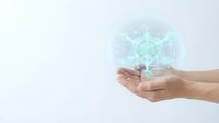 Hands holding glowing digital hexagonal network structure representing technology, innovation, and data connectivity for business solutions.