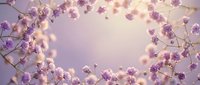Delicate purple flowers create elegant frame border on soft lavender background with warm bokeh lights for spring wedding invitations and romantic designs.