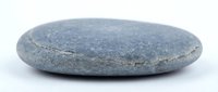 Smooth gray granite stone isolated on white background for spa wellness meditation zen garden landscaping natural decoration mineral geology specimen.