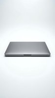 Closed silver aluminum laptop isolated on white background, sleek modern design for technology, business, and computing concepts.