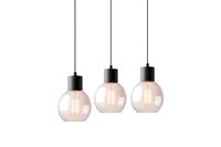 Modern pendant lights with round glass shades and black metal fixtures hanging in row formation against white background, illuminated with warm LED filaments.