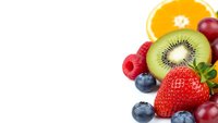 Fresh mixed fruits including strawberry, kiwi, orange, blueberries, raspberries and cherries arranged on white background for healthy eating concepts.