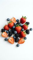 Fresh mixed berries collection with strawberries, blueberries and blackberries isolated on white background for healthy eating and nutrition concepts.