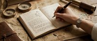 Young woman with fair skin writing in an open journal with a fountain pen at a wooden desk surrounded by vintage navigation tools, antique compass, old maps, and brass instruments, capturing a moment of journaling, planning, or creative writing for lifestyle, education, and nostalgic design projects.
