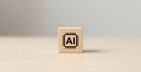 Wooden cube block with AI microchip symbol on neutral background representing artificial intelligence technology and machine learning concepts.