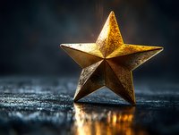 Golden star decoration on dark textured surface with dramatic lighting creating atmospheric glow and reflection for holiday or celebration designs.