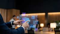 Businessman using holographic digital interface with data analytics charts and graphs in modern office environment for futuristic technology presentation.