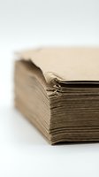 Vintage aged book with worn pages and weathered cover on white background for educational and literary design projects.