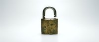 Antique brass padlock with weathered patina and ornate details isolated on white background, suitable for security, vintage, and design projects.