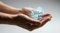 Caucasian male hands holding glowing digital gear and link symbols, representing technology integration, workflow automation, and connected systems for business solutions.