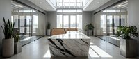 Modern luxury office lobby with marble reception desk and glass walls featuring natural light from skylights and large windows.