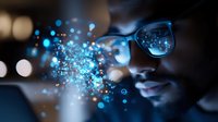 Digital transformation concept showing person wearing glasses with glowing blue particles and bokeh lights emerging, representing virtual reality and technological innovation.