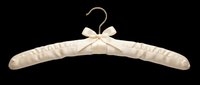 Elegant ivory satin padded clothes hanger with bow and pearl details, isolated on transparent background, ready for T-shirt, sticker, clipart, and print on demand use.