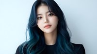 Young Asian woman with vibrant blue ombre hair wearing black top against white background, showcasing modern beauty and fashion trends in contemporary portrait style.
