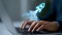 Glowing neon rocket icon floating above laptop keyboard with smoke effect, symbolizing startup business launch and digital innovation in modern workspace.