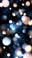 Magical glowing bokeh lights on dark background with sparkles and blurred circles in blue, white and golden colors create dreamy cosmic atmosphere.