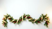 Christmas garland with pine branches, red berries and pinecones arranged in decorative zigzag pattern on white background for holiday decor and seasonal design.