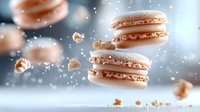Delicate pink macarons floating in air with crumbs and sparkles against blurred gray background, creating dreamy atmosphere for food photography and pastry ads.