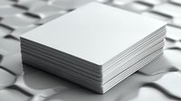 Stack of blank white plastic cards on blurred background with selective focus, ready for mockup and branding design presentation.