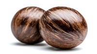 Fresh whole coconuts with brown fibrous shell on white background, natural tropical fruit close-up showing texture and detail, isolated food photography.