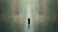 Silhouette of solitary figure standing in minimalist corridor with atmospheric fog and geometric architecture, conveying isolation, contemplation, and modern urban environment.