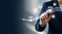 Businessman in navy suit touching holographic timeline displaying decades from 2020s to 2030s with glowing tech icons, representing future planning and digital innovation.