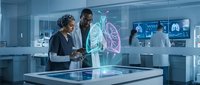 Two diverse medical professionals examining holographic lung anatomy display in modern hospital laboratory for respiratory health diagnosis and treatment planning.