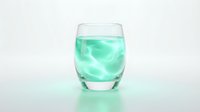 Refreshing mint green beverage with ice cubes in clear glass on white background, isolated for beverage, wellness and drink design projects.