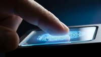 Finger touching smartphone screen with glowing blue fingerprint scanner for biometric security authentication and digital identity verification.