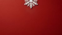 White snowflake ornament on deep red background, isolated design element suitable for holiday cards, winter decorations, seasonal marketing materials and festive graphic projects.
