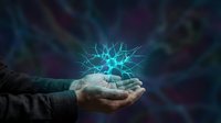 Hands holding glowing electric energy ball with lightning bolts against dark background. Concept for power, electricity, magic, technology innovation.
