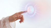 Female hand reaching toward glowing sacred geometry symbol with ethereal light effects and magical energy particles for spiritual wellness concepts.