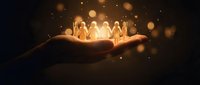 Glowing paper cutout figures holding hands in cupped palm with warm bokeh lights symbolizing unity, teamwork, community support and human connection.