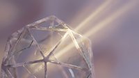 Transparent geometric crystal structure with light rays passing through faceted surfaces, suitable for abstract backgrounds, design overlays, and modern visual concepts.