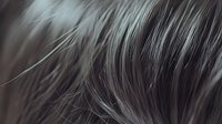 Close-up macro shot of soft gray animal fur or hair texture showing individual strands in selective focus creating abstract natural pattern background.