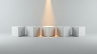 Minimalist arrangement of white cylindrical containers with golden light beam emerging from center, isolated on neutral background for product display and design projects.
