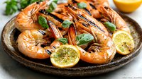 Grilled jumbo shrimp served on rustic ceramic plate with fresh lemon slices, garnished with aromatic herbs and citrus marinade, close up view of seafood dish.