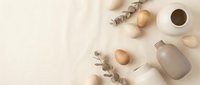 Minimalist spa wellness flat lay with natural cosmetic bottles, wooden spheres, eucalyptus branches and coffee cup on neutral beige background.