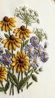 Hand embroidered wildflower bouquet with yellow daisies and purple asters on natural linen fabric showcasing traditional needlework and botanical textile art.